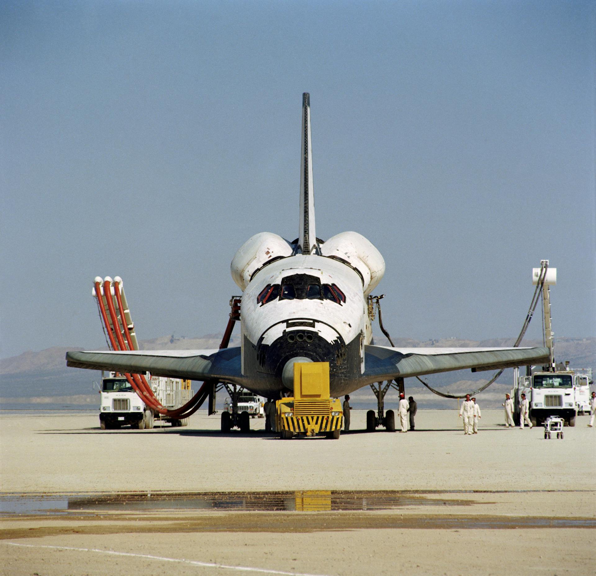 Space Shuttle Columbia receives post-landing servicing following a successful touchdown.